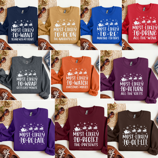 A collection of Christmas-themed screen print transfers in various colors, featuring text designs such as 'MOST LIKELY TO SLEEP IN' and 'MOST LIKELY TO RETURN THE PRESENTS', displayed on a variety of shirts.
